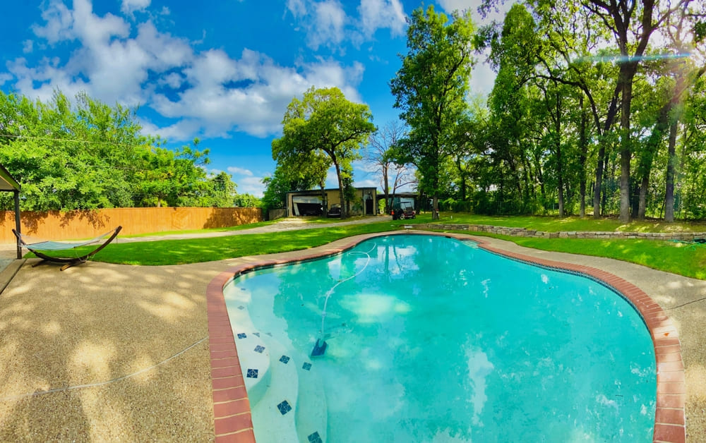 Residential backyard with a beautiful inground pool